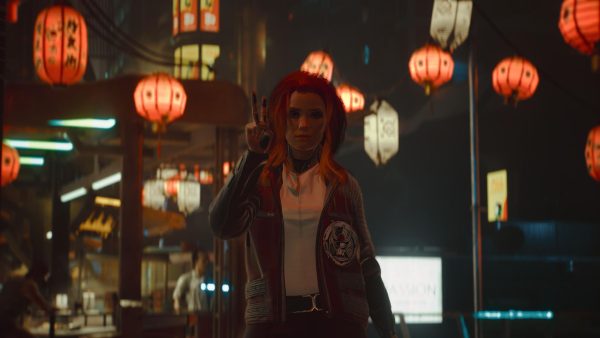 A cgi woman with red hair stood showing peace sign at camera. Behind her is a market stall and lots of hanging chinese lanterns